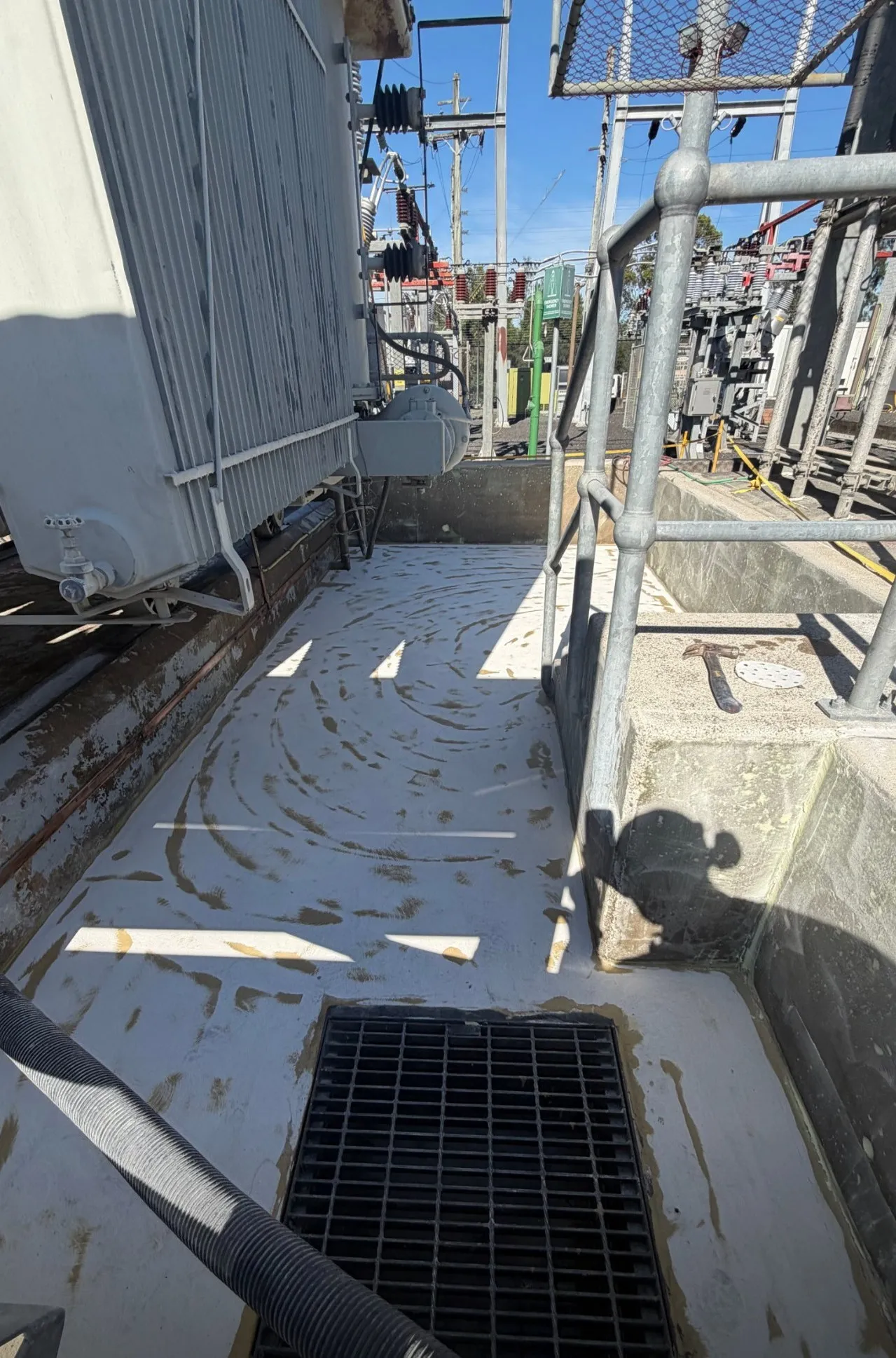 Polyurethane cement applied to a bund floor beside a transformer.